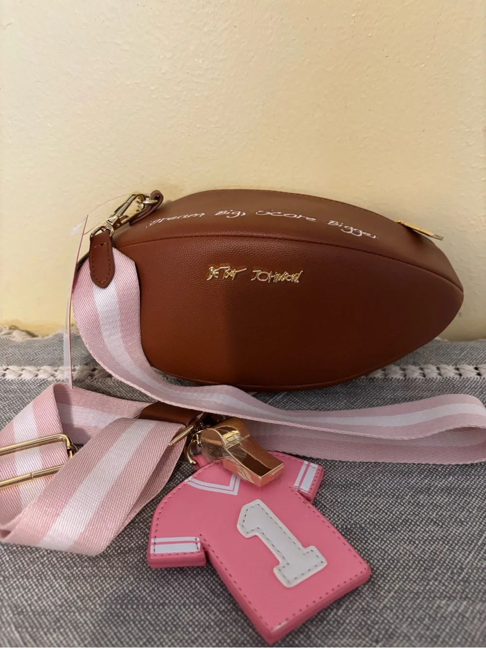 Betsey Johnson Brown & Pink Football Crossbody with Pink Striped Strap and Charm